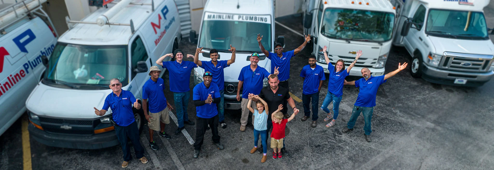 friendly team infront of trucks